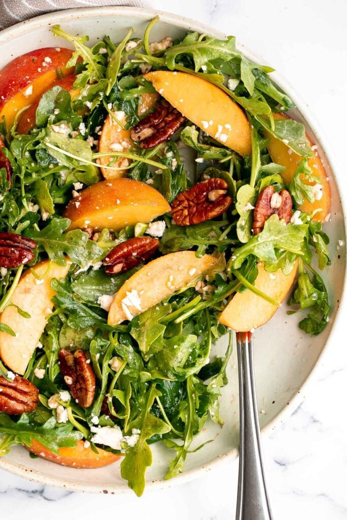 Peach arugula salad with balsamic vinaigrette is an easy delicious summer salad made with a handful of simple ingredients that packs on lots of flavor. | aheadofthyme.com