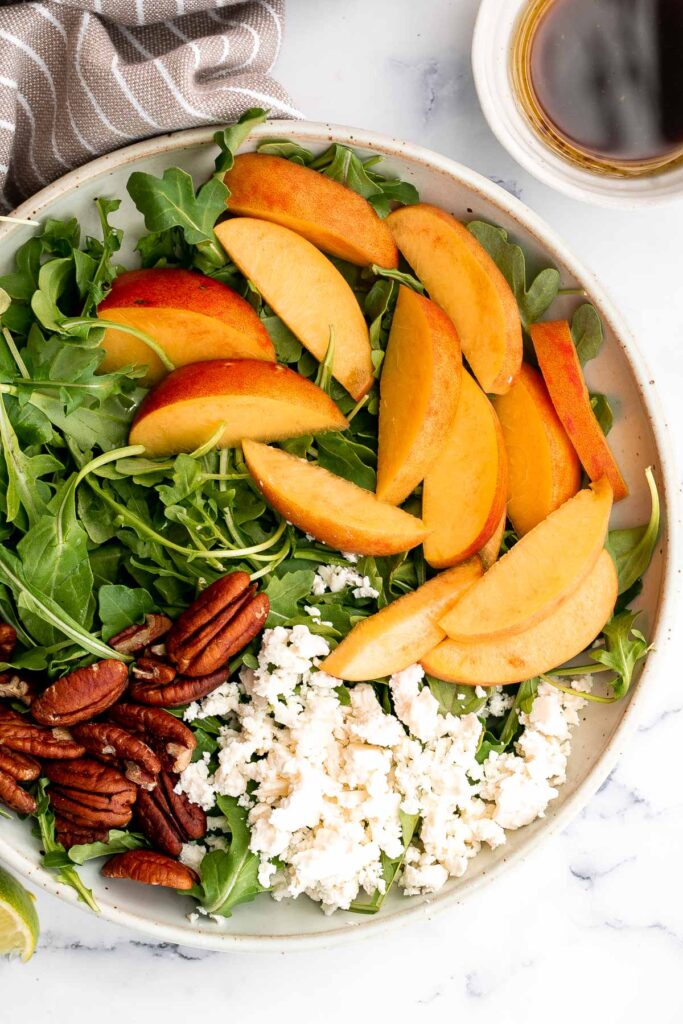 Peach arugula salad with balsamic vinaigrette is an easy delicious summer salad made with a handful of simple ingredients that packs on lots of flavor. | aheadofthyme.com