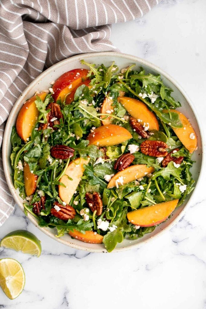 Peach arugula salad with balsamic vinaigrette is an easy delicious summer salad made with a handful of simple ingredients that packs on lots of flavor. | aheadofthyme.com