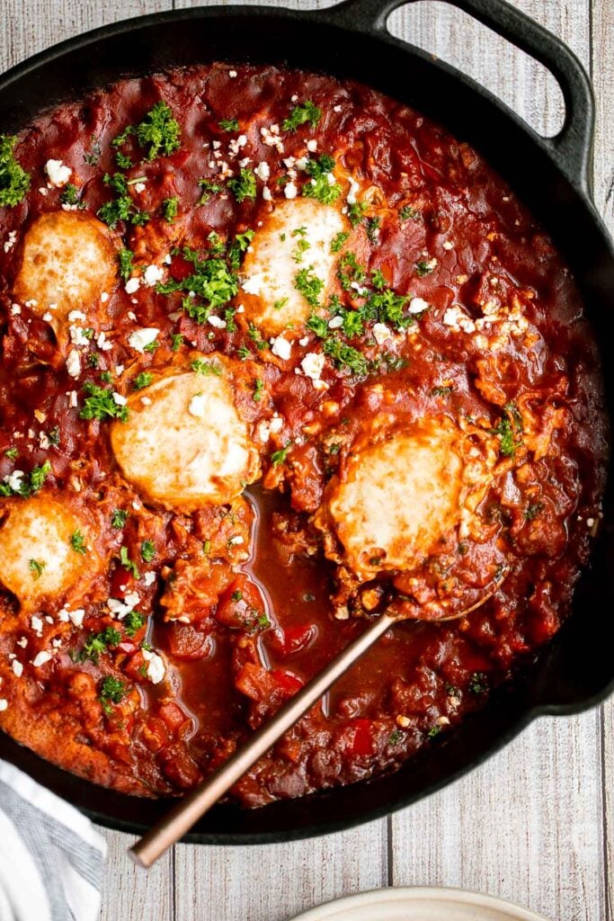 Shakshuka is a quick and easy, one-pan Middle Eastern classic with a savory saucy tomato-vegetable base and perfectly poached eggs on top. | aheadofthyme.com