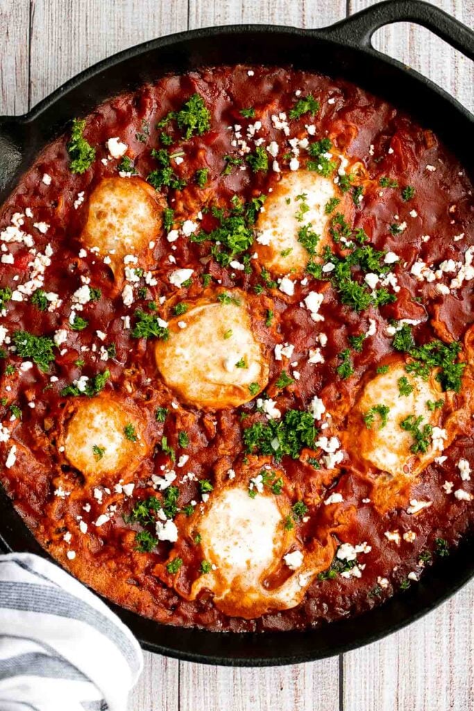 Shakshuka is a quick and easy, one-pan Middle Eastern classic with a savory saucy tomato-vegetable base and perfectly poached eggs on top. | aheadofthyme.com