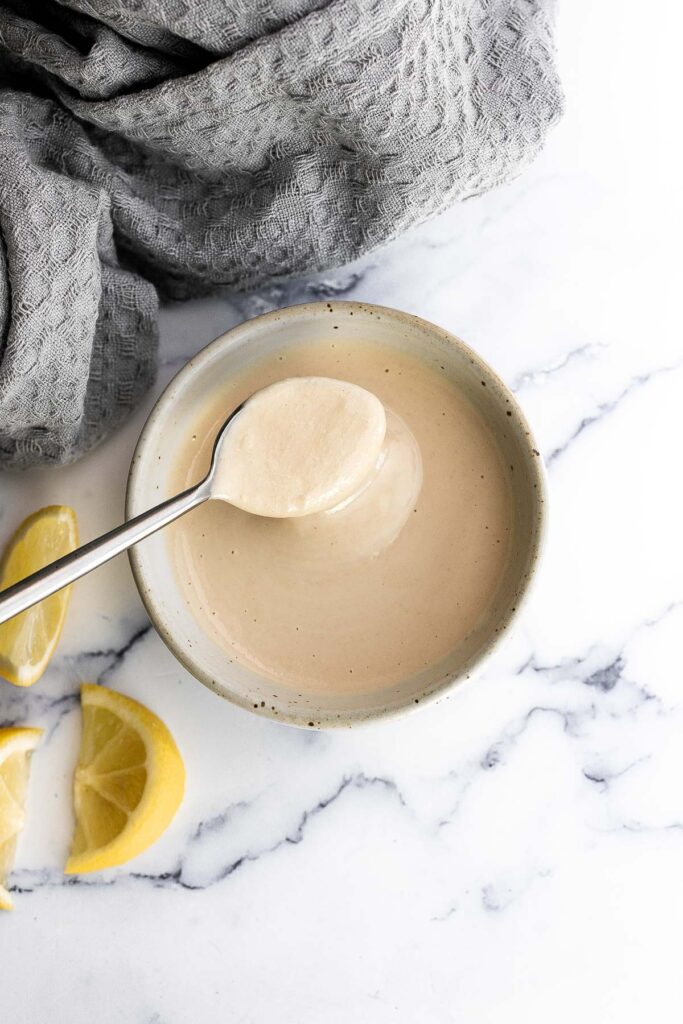 Tahini sauce is creamy, smooth, nutty, and flavorful. Made in just 5 minutes with a handful of ingredients, add this gluten-free, vegan sauce on everything. | aheadofthyme.com