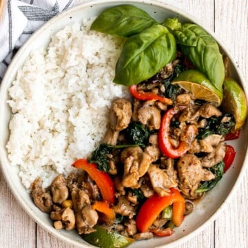 Better than takeout, Thai basil chicken with a delicious homemade sauce is a quick and easy, light and fresh chicken stir fry that is ready in 25 minutes. | aheadofthyme.com