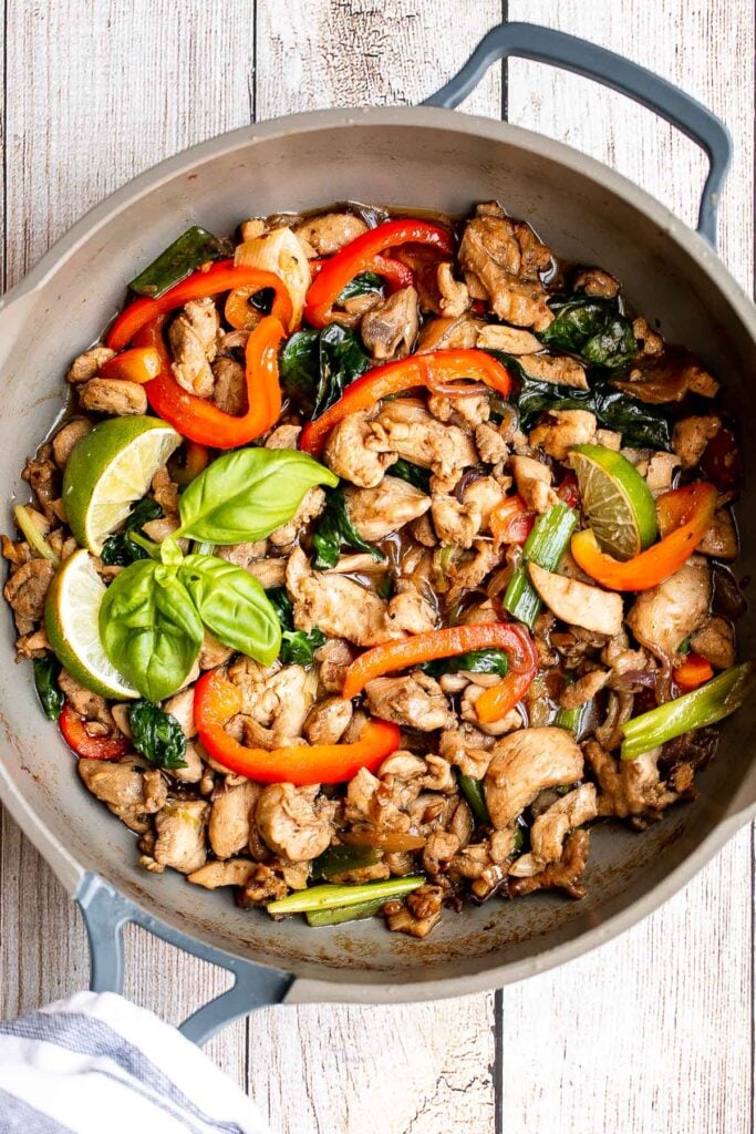 Better than takeout, Thai basil chicken with a delicious homemade sauce is a quick and easy, light and fresh chicken stir fry that is ready in 25 minutes. | aheadofthyme.com