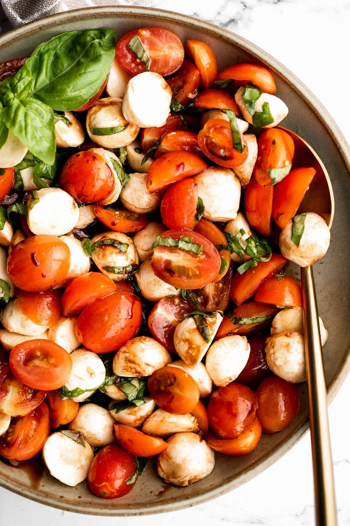 Quick and easy tomato and mozzarella caprese salad is a fresh, light, and delicious summer salad, made with just a few simple ingredients in 10 minutes. | aheadofthyme.com