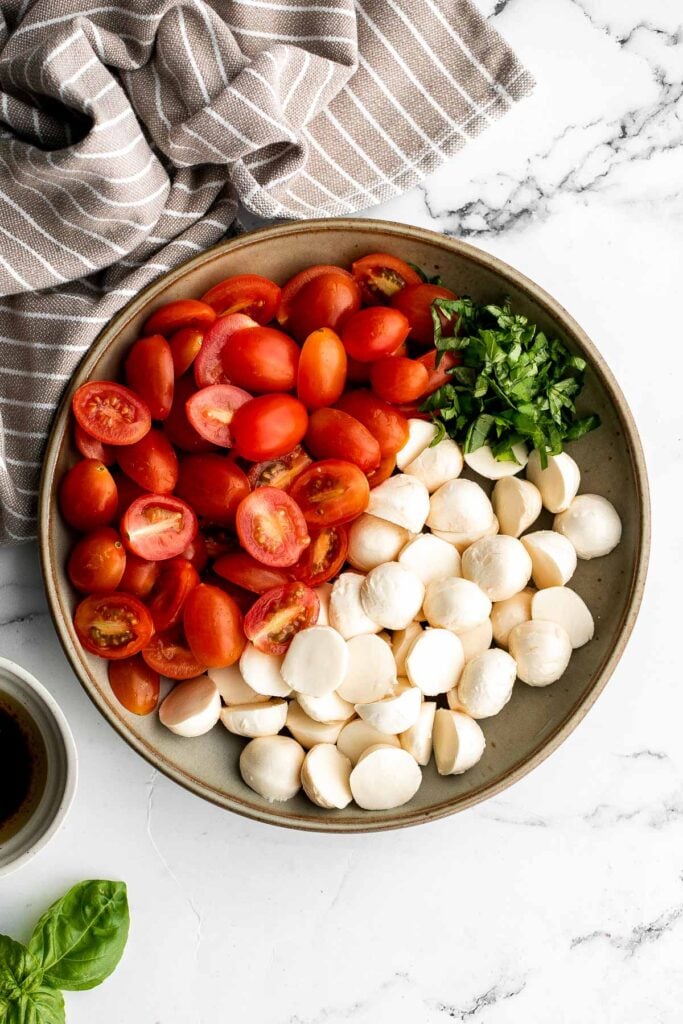 Quick and easy tomato and mozzarella caprese salad is a fresh, light, and delicious summer salad, made with just a few simple ingredients in 10 minutes. | aheadofthyme.com