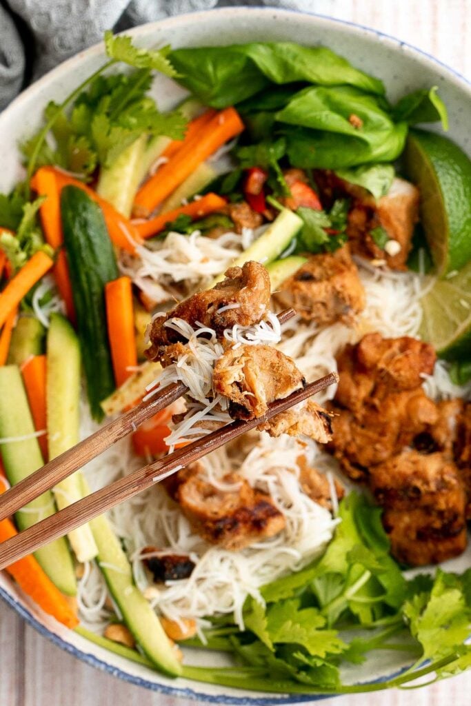 Vietnamese noodle bowl with lemongrass chicken, fresh vegetables and herbs, tossed in a homemade Vietnamese sauce is healthy, delicious, light, and filling. | aheadofthyme.com