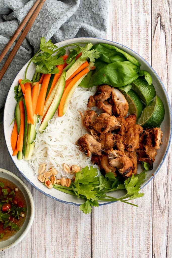 Vietnamese noodle bowl with lemongrass chicken, fresh vegetables and herbs, tossed in a homemade Vietnamese sauce is healthy, delicious, light, and filling. | aheadofthyme.com