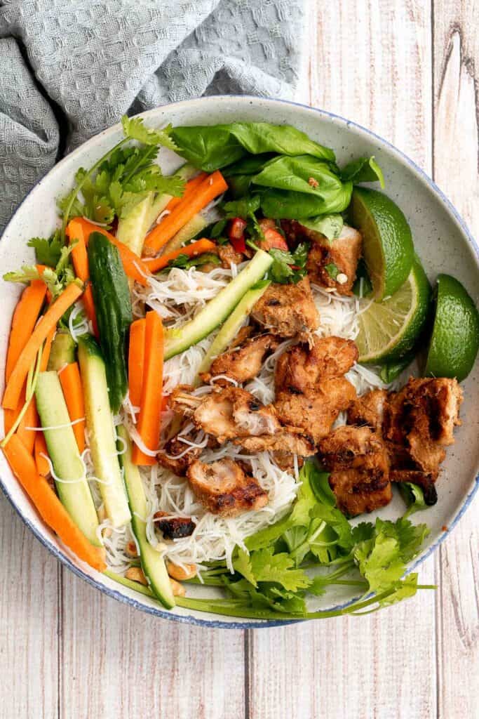 Vietnamese noodle bowl with lemongrass chicken, fresh vegetables and herbs, tossed in a homemade Vietnamese sauce is healthy, delicious, light, and filling. | aheadofthyme.com