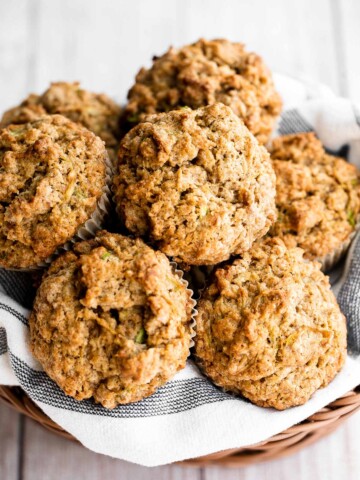 Quick and easy zucchini muffins are loaded with fresh zucchini which makes them fluffy, moist, delicious, and full of nutrients. Freezer-friendly too! | aheadofthyme.com
