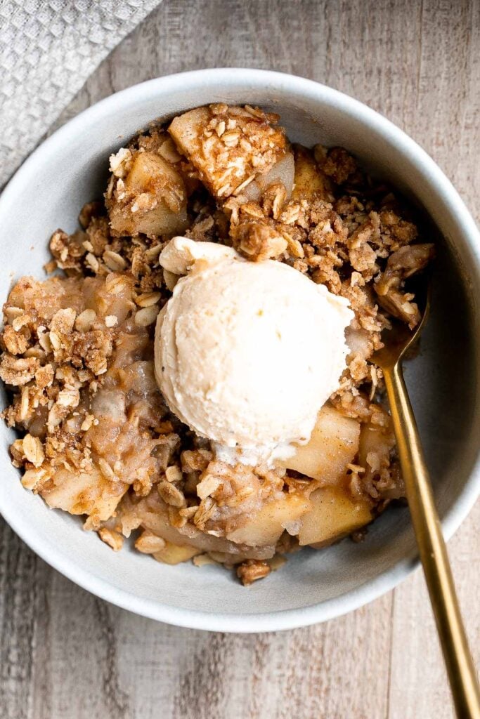 Apple crisp with tender cinnamon-sugar apples and crispy oat topping is sweet, tart, and just as delicious as an apple pie but takes a lot less effort. | aheadofthyme.com