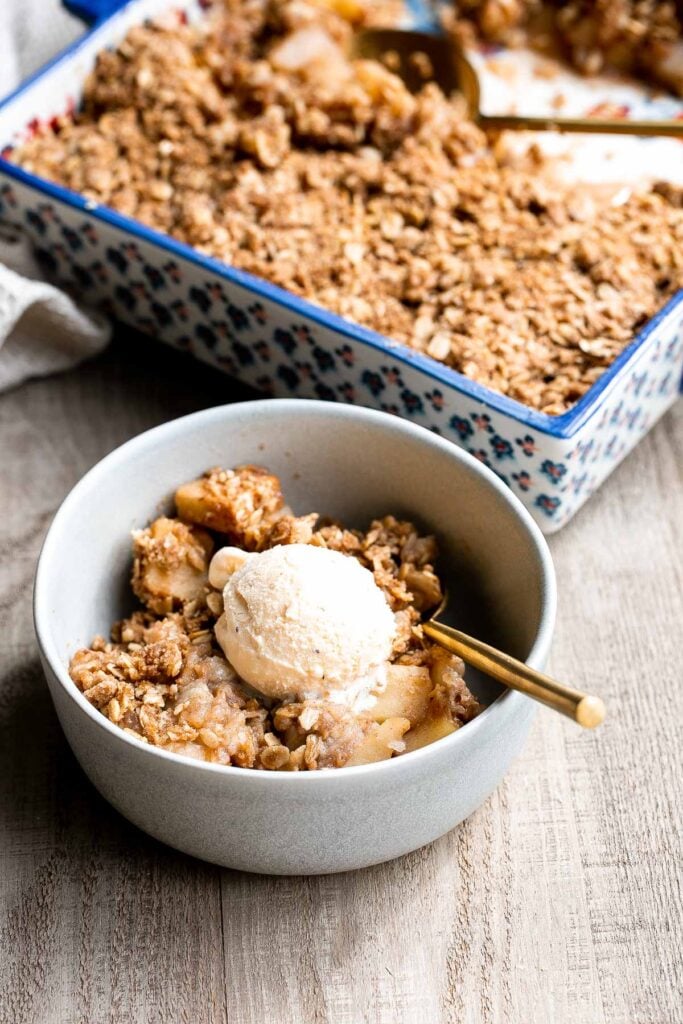 Apple crisp with tender cinnamon-sugar apples and crispy oat topping is sweet, tart, and just as delicious as an apple pie but takes a lot less effort. | aheadofthyme.com