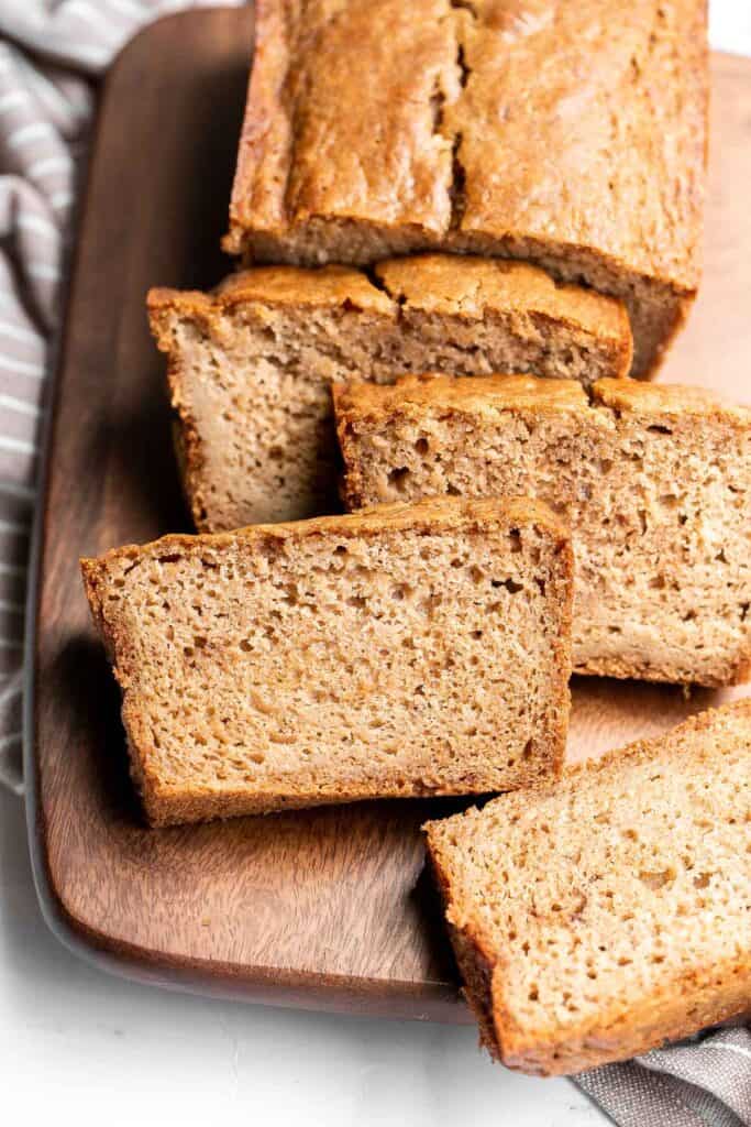 Homemade applesauce bread is fluffy, moist, and delicious. Loaded with fall flavors that transforms your favorite snack into a loaf cake. | aheadofthyme.com