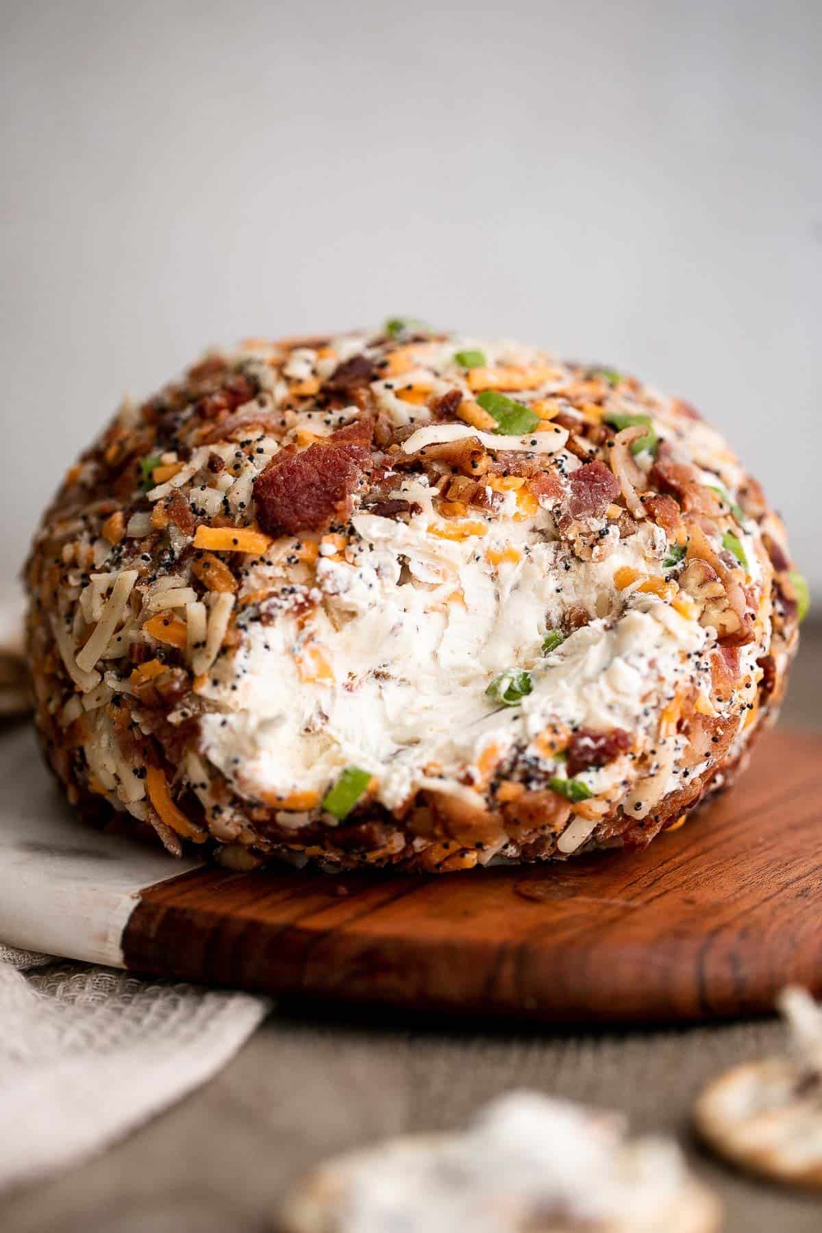 Bacon cheddar cheese ball is an easy to make appetizer and delicious showstopper at holiday parties or game day. It's creamy, cheesy, and nutty. | aheadofthyme.com