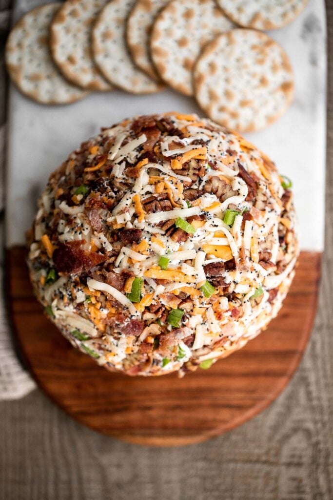 Bacon cheddar cheese ball is an easy to make appetizer and delicious showstopper at holiday parties or game day. It's creamy, cheesy, and nutty. | aheadofthyme.com