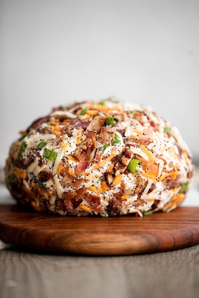 Bacon cheddar cheese ball is an easy to make appetizer and delicious showstopper at holiday parties or game day. It's creamy, cheesy, and nutty. | aheadofthyme.com