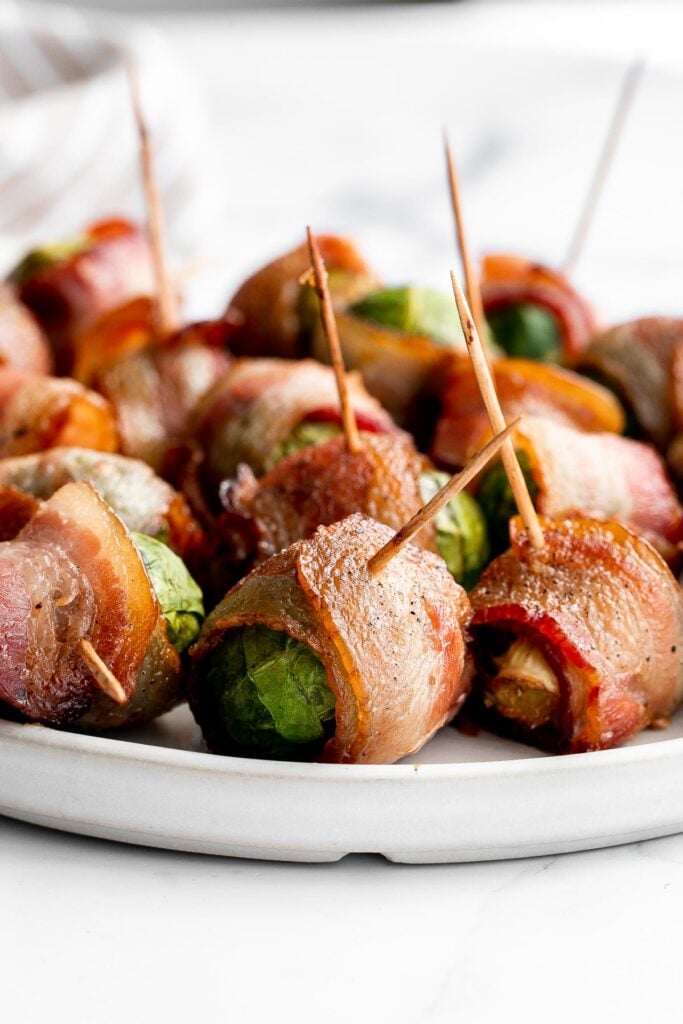 Bacon wrapped brussels sprouts are the sweet, savory, and salty appetizer that you need at your next holiday gathering this fall. Simple and easy to make. | aheadofthyme.com