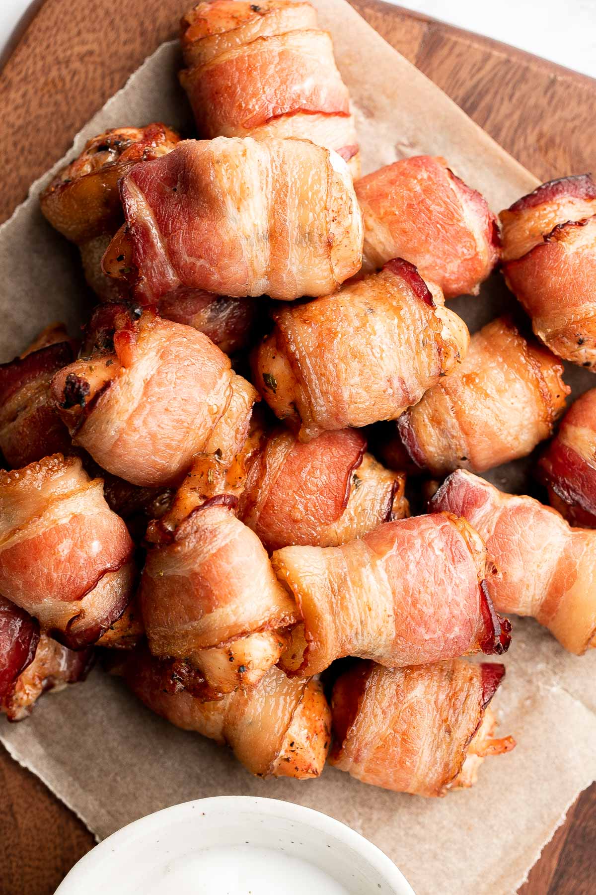 Bacon wrapped chicken bites are one of the best appys ever — well seasoned tender juicy chicken is wrapped in bacon and oven-baked to crisp perfection. | aheadofthyme.com