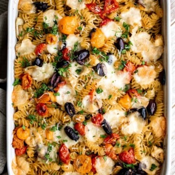 Baked Mediterranean pasta is simple, flavorful, and vibrant, loaded with fresh tomatoes, artichoke hearts, and olives, and topped with mozzarella cheese. | aheadofthyme.com