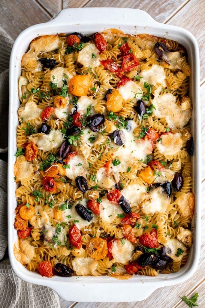 Baked Mediterranean pasta is simple, flavorful, and vibrant, loaded with fresh tomatoes, artichoke hearts, and olives, and topped with mozzarella cheese. | aheadofthyme.com