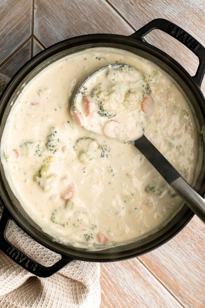 Broccoli cheese soup is creamy, cozy, and delicious simmered in a buttery cheesy broth for the perfect blend of textures and flavors — comfort food goals. | aheadofthyme.com