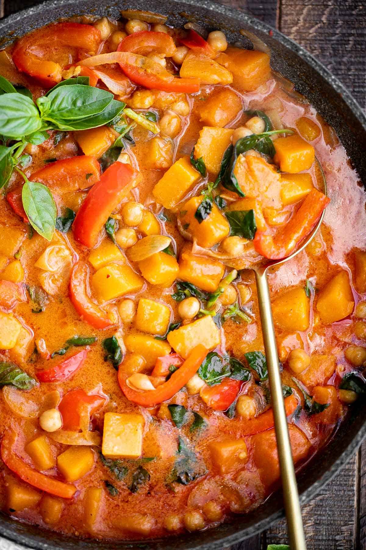 Butternut squash curry with chickpeas is a rich hearty one pot meal that will satisfy your fall comfort food cravings. Great for weeknight family dinners. | aheadofthyme.com