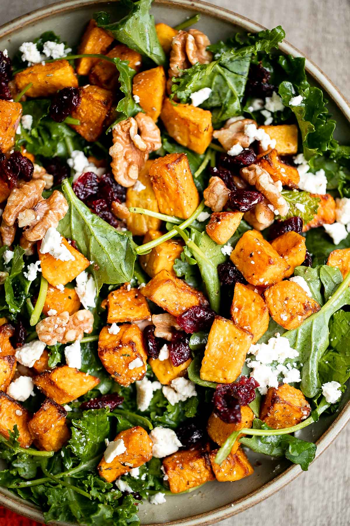 Butternut squash salad is a light meal that's loaded with fall flavors — roasted butternut squash, baby kale, walnuts, dried cranberries, and feta. | aheadofthyme.com