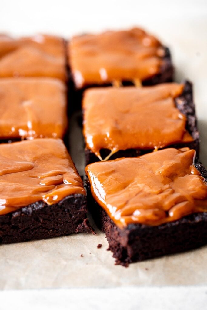 Caramel brownies are rich, moist, and decadent. Baked from the thickest and indulgent chocolate batter and topped with a homemade creamy caramel sauce. | aheadofthyme.com