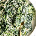 Creamed spinach is a rich, creamy, and delicious side dish to make this fall. Easy to make ahead and reheats well — perfect for Thanksgiving holiday dinner. | aheadofthyme.com