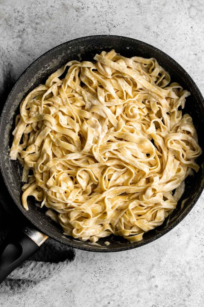 Fettuccine alfredo is a classic Italian pasta dish that is rich, creamy, and delicious. Plus, it comes together in less than 15 minutes! | aheadofthyme.com