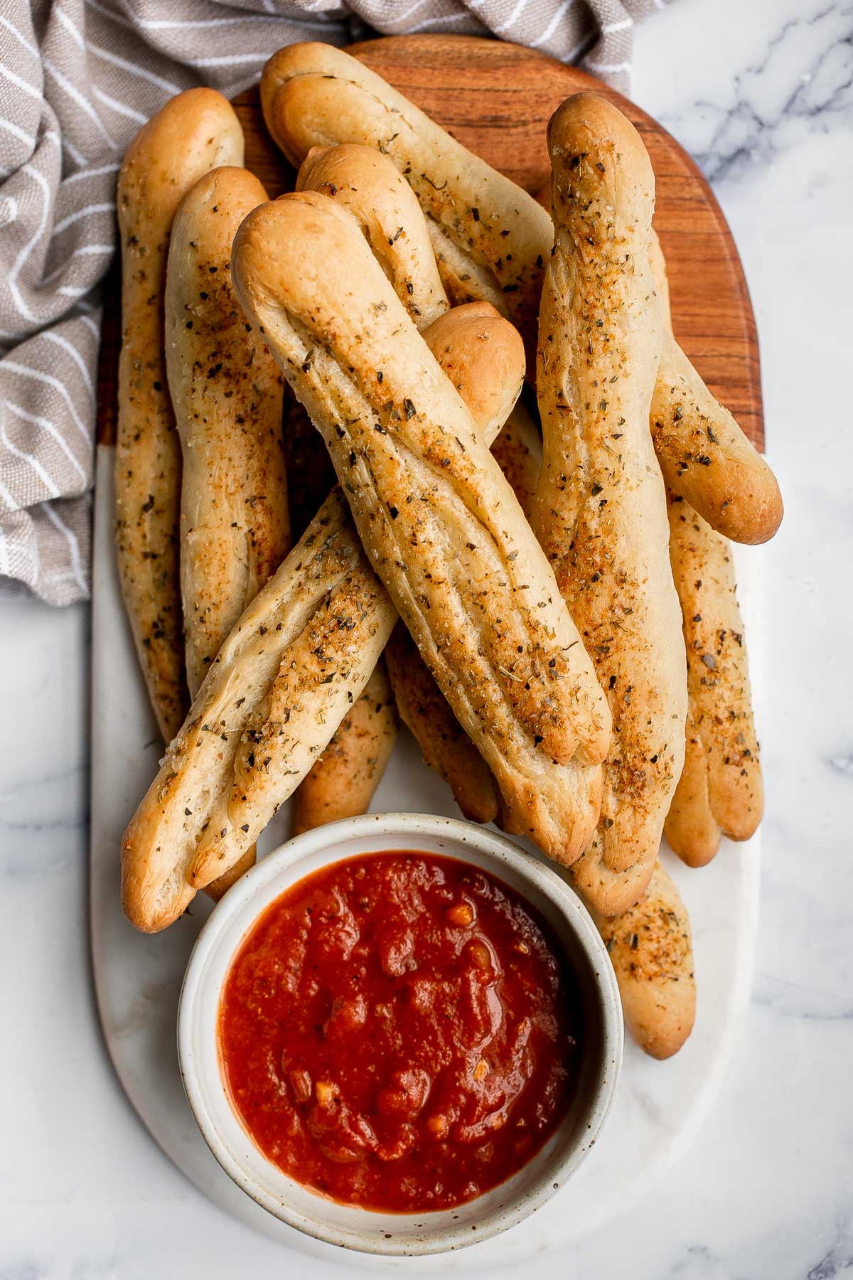 Soft garlic breadsticks are fluffy, airy, buttery, and delicious. They're an easy recipe that is perfect for beginners at baking bread. | aheadofthyme.com