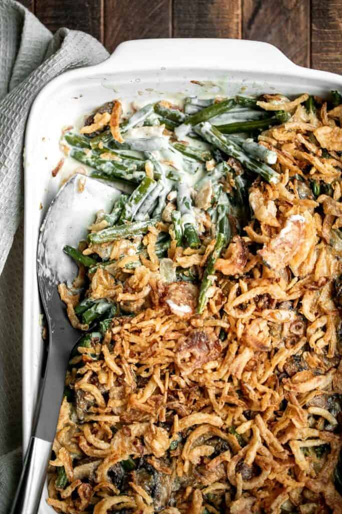 Green bean casserole is a classic holiday side dish packed with fresh green beans in a delicious creamy mushroom sauce, and topped with crispy fried onions. | aheadofthyme.com