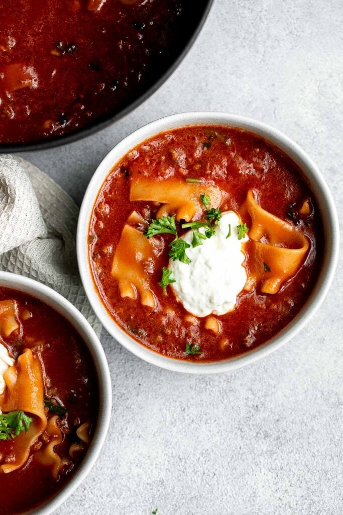 Lasagna soup is a twist on a classic Italian recipe with all the same delicious comforting flavors in the form of a hearty one pot soup. | aheadofthyme.com