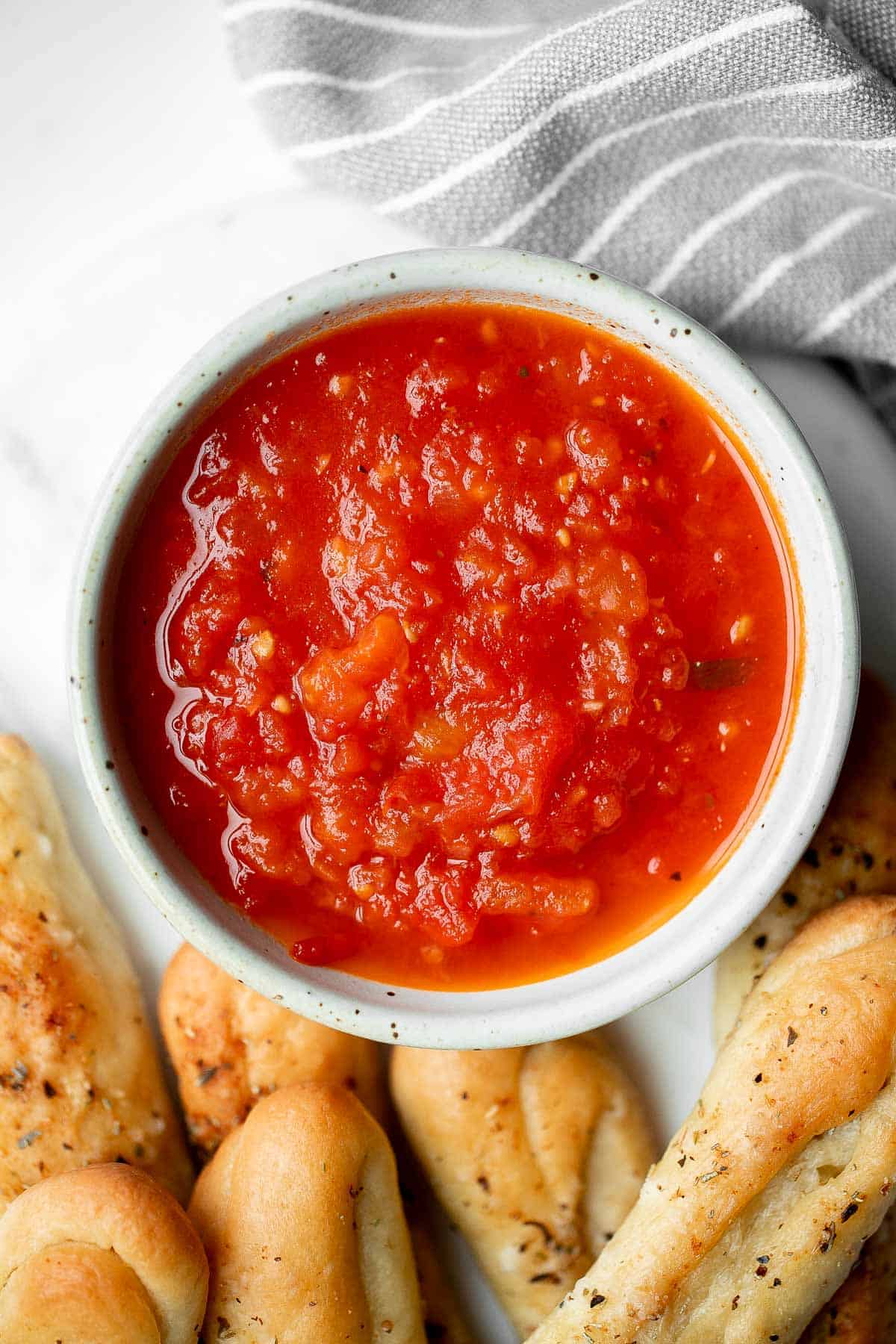 Marinara sauce is rich, vibrant, and loaded with flavor. It’s easy to make with a few simple fresh ingredients. Serve as a dip or in pasta and pizza. | aheadofthyme.com