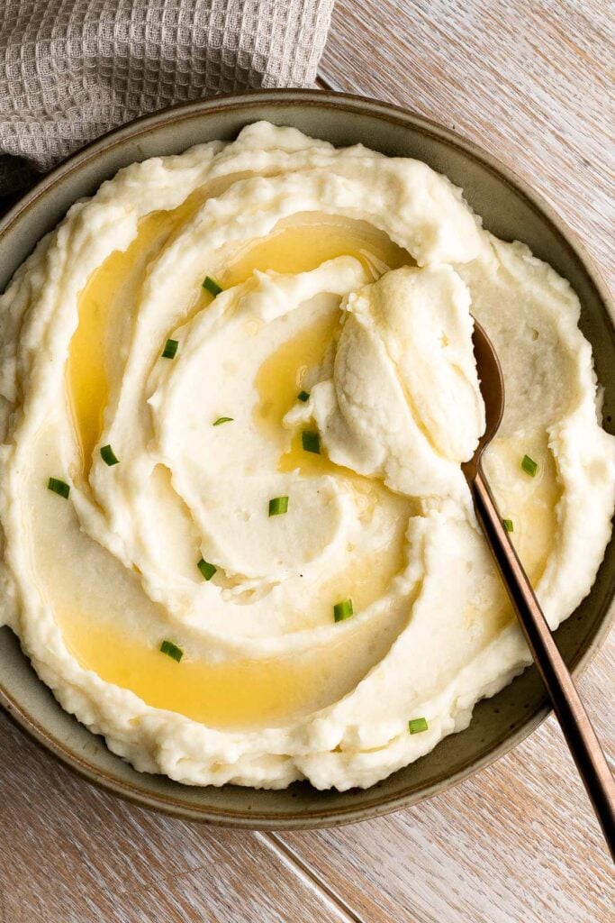 Mascarpone mashed potatoes are creamy, smooth, and comforting. Classic mashed potatoes are given a twist resulting in a super silky and rich mash. | aheadofthyme.com