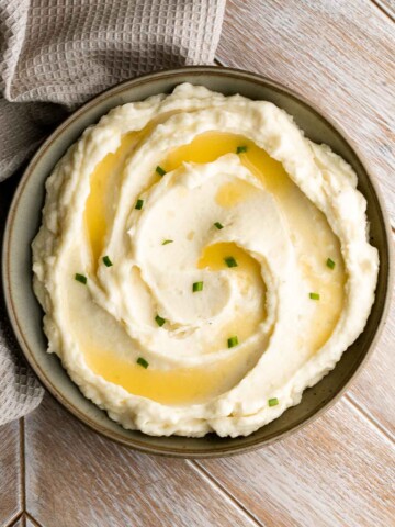 Mascarpone mashed potatoes are creamy, smooth, and comforting. Classic mashed potatoes are given a twist resulting in a super silky and rich mash. | aheadofthyme.com