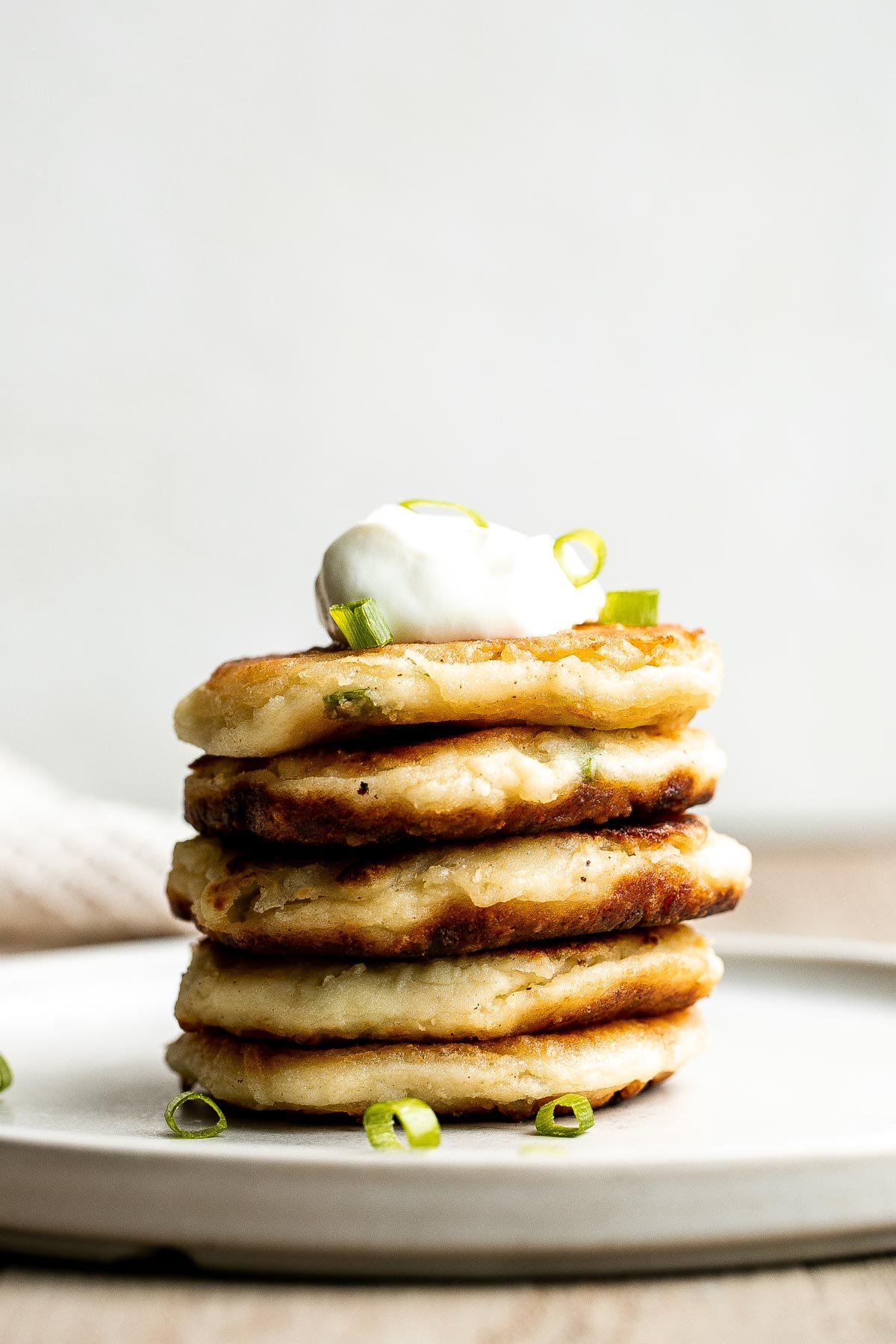 Mashed potato cakes are light and fluffy inside, crispy golden outside, and so delicious and flavorful. The best way to use up leftover mashed potatoes! | aheadofthyme.com