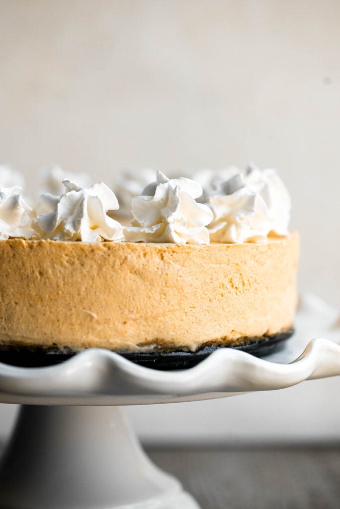 No bake pumpkin cheesecake is the easiest cheesecake to make this fall. It's light, smooth, creamy, and loaded with fall flavors like pumpkin and cinnamon. | aheadofthyme.com