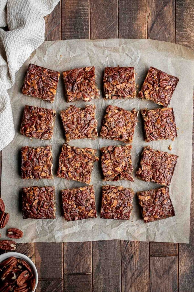 Pecan pie bars are the best and easiest way to enjoy the flavors of pecan pie but with half the effort and in a handheld bite-sized form. | aheadofthyme.com