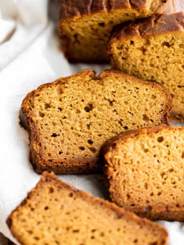 Pumpkin bread is fluffy, moist, and delicious. This classic fall loaf cake is loaded with real pumpkin and seasonal spices like cinnamon and ginger. | aheadofthyme.com