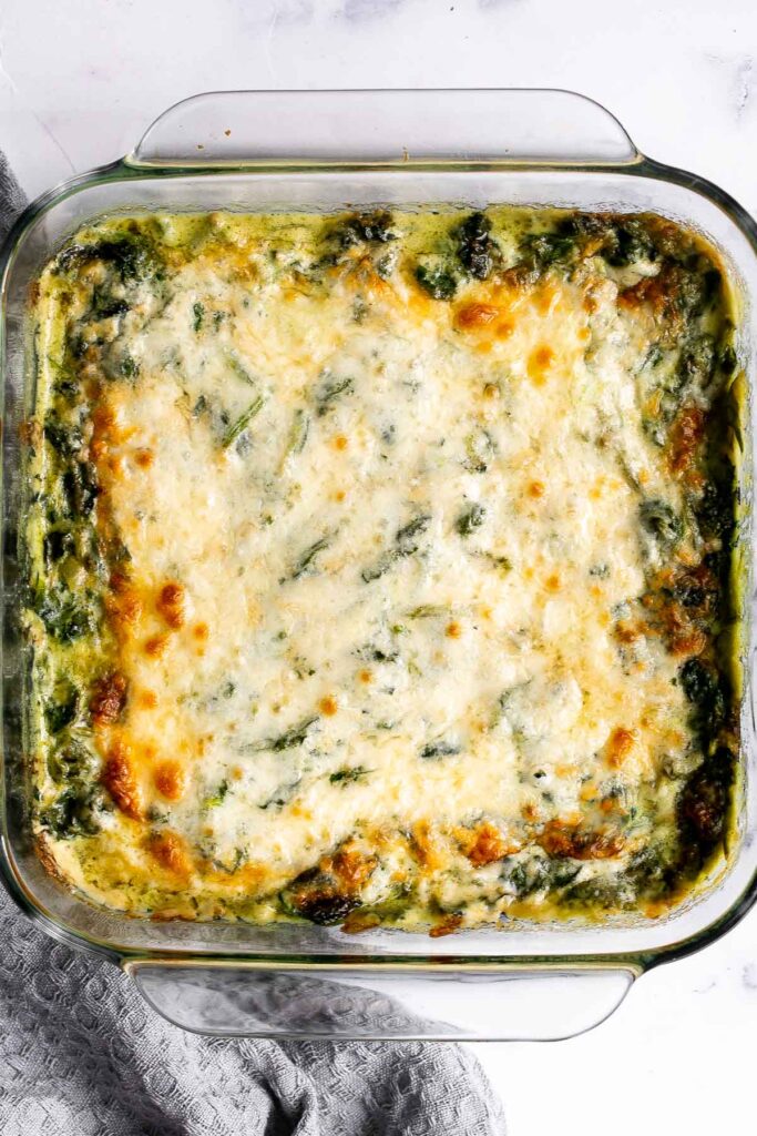 Spinach gratin is a rich and creamy side dish with a layer of crispy melty cheese on top. This fancy side is easy to make ahead and freezer-friendly. | aheadofthyme.com