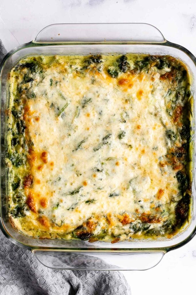 Spinach gratin is a rich and creamy side dish with a layer of crispy melty cheese on top. This fancy side is easy to make ahead and freezer-friendly. | aheadofthyme.com