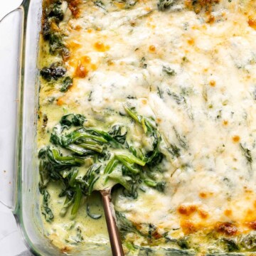 Spinach gratin is a rich and creamy side dish with a layer of crispy melty cheese on top. This fancy side is easy to make ahead and freezer-friendly. | aheadofthyme.com