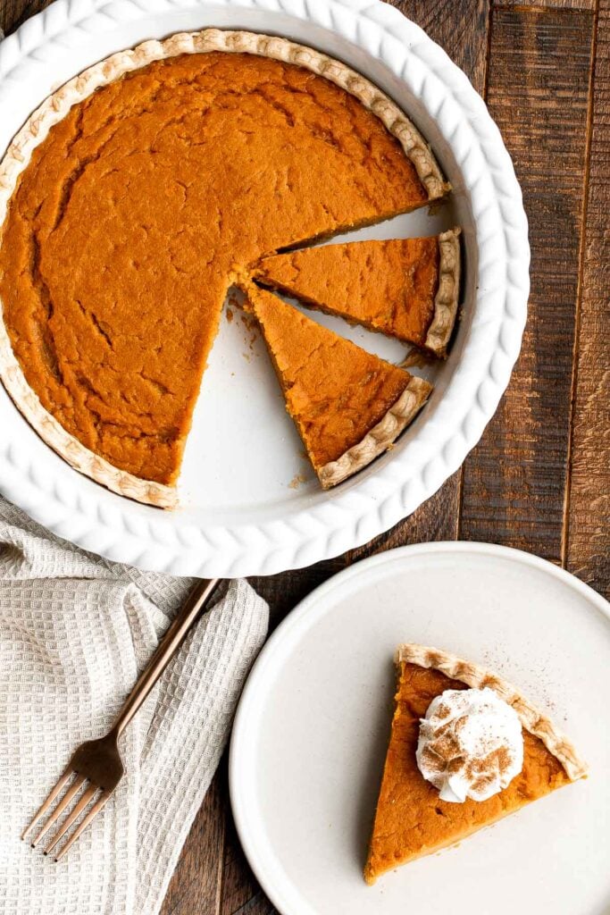 Sweet potato pie is warm and cozy, spiced with classic fall flavors, and delicious. Easy to make with cooked sweet potatoes or canned sweet potato puree. | aheadofthyme.com