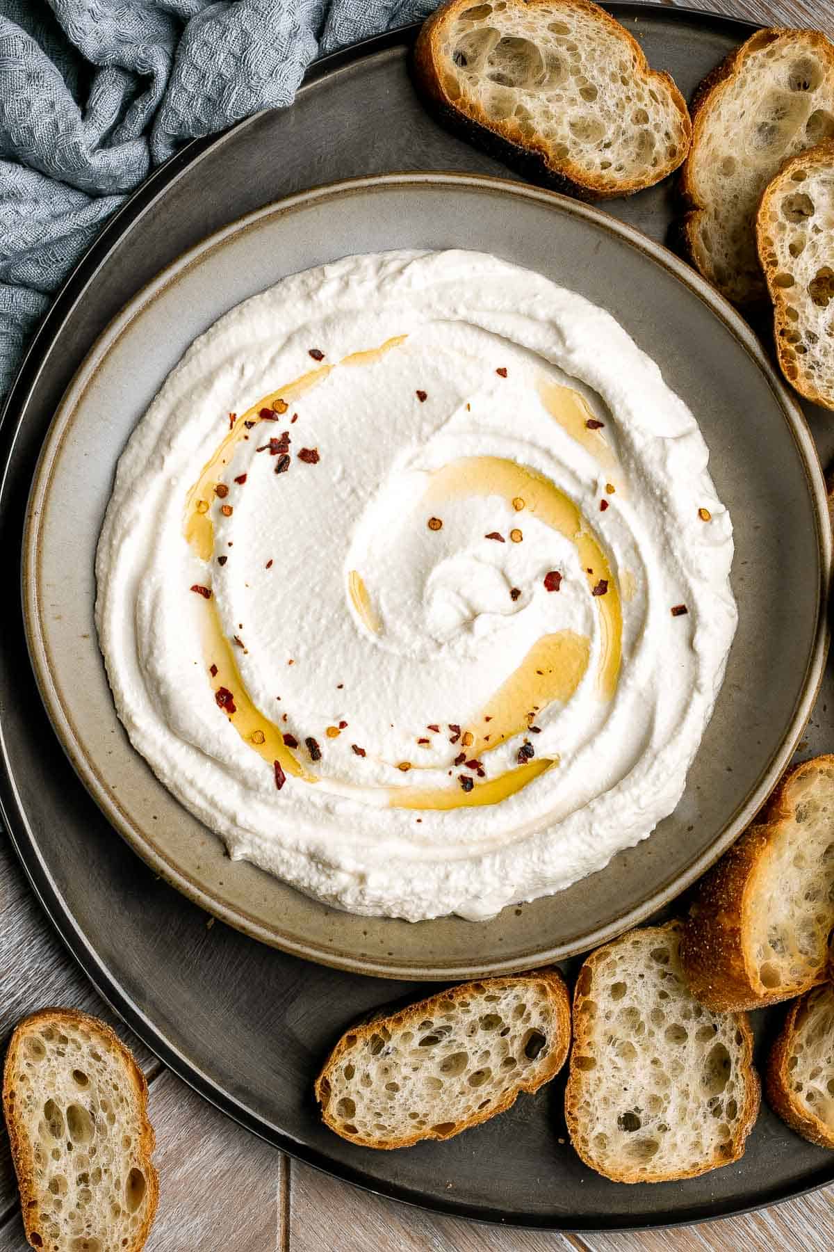 Whipped feta is light, airy, and fluffy. It's an easy yet impressive recipe that takes only 5 minutes to make in a blender with 3 simple ingredients. | aheadofthyme.com