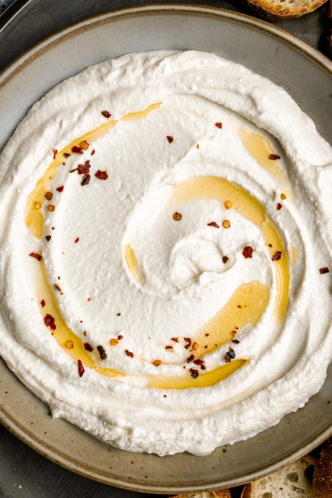 Whipped feta is light, airy, and fluffy. It's an easy yet impressive recipe that takes only 5 minutes to make in a blender with 3 simple ingredients. | aheadofthyme.com