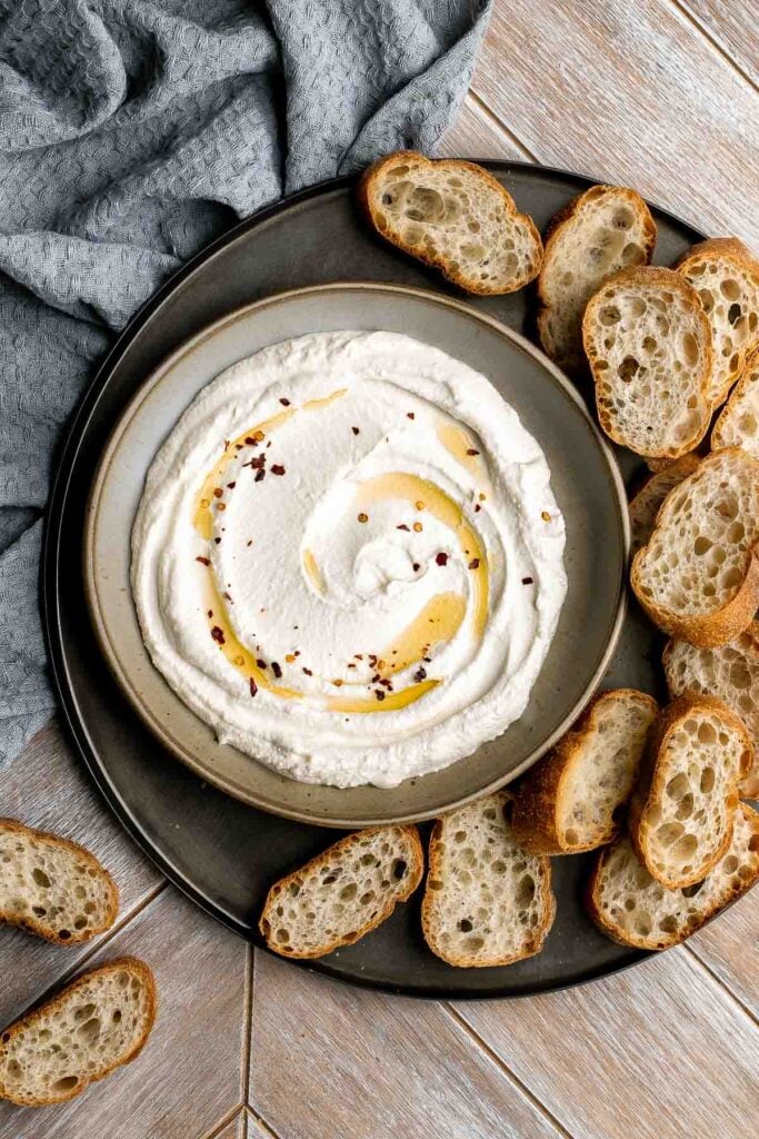 Whipped feta is light, airy, and fluffy. It's an easy yet impressive recipe that takes only 5 minutes to make in a blender with 3 simple ingredients. | aheadofthyme.com