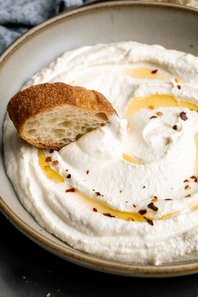 Whipped feta is light, airy, and fluffy. It's an easy yet impressive recipe that takes only 5 minutes to make in a blender with 3 simple ingredients. | aheadofthyme.com