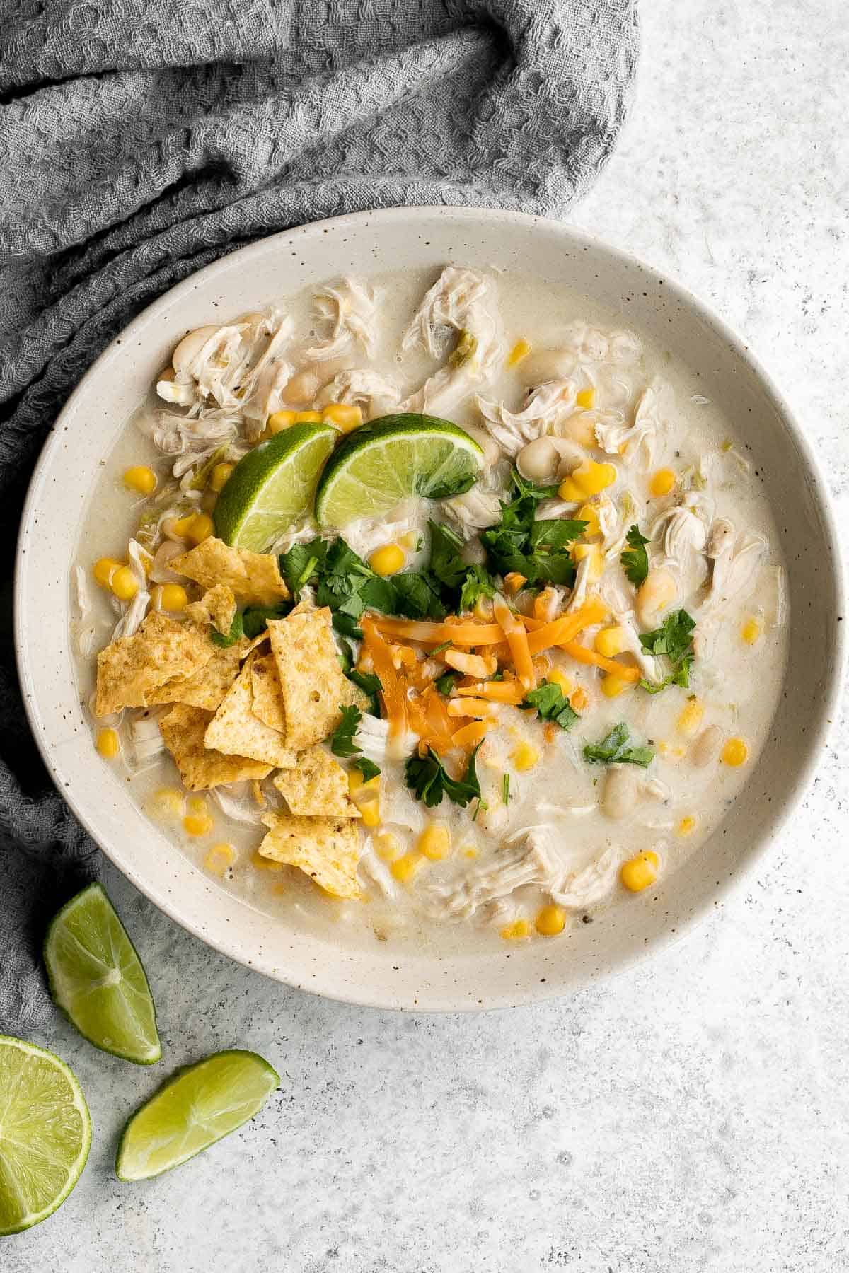 White chicken chili is an easy and delicious one pot meal made with shredded chicken, hearty veggies, and a creamy broth that's loaded with flavor. | aheadofthyme.com