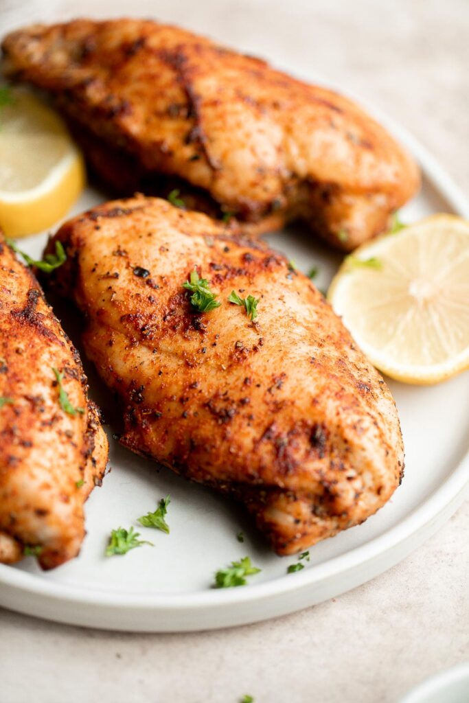 Air fryer chicken breast is crispy on the outside, juicy and tender inside, and packed with flavor in every bite. Quick and easy dinner on busy weeknights. | aheadofthyme.com